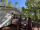 This home features a charming deck and classic exterior with red shutters at 5130 English Dr, Cumming, GA 30041