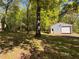 Metal building with a roll-up door offers garage space at 5130 English Dr, Cumming, GA 30041