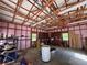 Spacious garage interior with wood framing, ample lighting, and storage cabinets at 5130 English Dr, Cumming, GA 30041