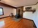 Living room with hardwood floors and a stone fireplace with wood burning stove at 5130 English Dr, Cumming, GA 30041