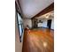 Cozy living room with hardwood floors, a fireplace, and large windows at 5130 English Dr, Cumming, GA 30041