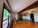 Living room with hardwood floors, stone fireplace, and large windows at 5130 English Dr, Cumming, GA 30041
