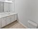 Bright bathroom with a white vanity, a large mirror, and a shower-tub combination at 5763 Mitchell Chase Trl, Mableton, GA 30126