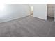 Spacious bedroom with neutral carpet, a walk-in closet, and access to an en-suite bathroom at 5763 Mitchell Chase Trl, Mableton, GA 30126