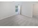 Light and bright bedroom includes window, light-grey carpet, and closet at 5763 Mitchell Chase Trl, Mableton, GA 30126