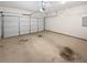 Spacious two car garage with a white door and concrete floor at 5763 Mitchell Chase Trl, Mableton, GA 30126