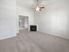 Open living room with fireplace, high ceilings, and neutral carpet at 5763 Mitchell Chase Trl, Mableton, GA 30126
