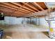Unfinished basement featuring exposed ceiling joists and concrete walls at 120 Westwood Nw Dr, Marietta, GA 30064