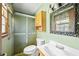 Bathroom featuring a glass-enclosed shower, vanity, and medicine cabinet at 120 Westwood Nw Dr, Marietta, GA 30064