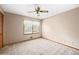 Neutral bedroom with a large window allowing ample natural light at 120 Westwood Nw Dr, Marietta, GA 30064