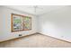 Bright bedroom with light carpet and a window overlooking the yard at 120 Westwood Nw Dr, Marietta, GA 30064