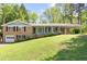 Charming brick home with an attached carport and garage at 120 Westwood Nw Dr, Marietta, GA 30064