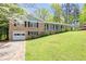 Charming brick home with garage and a well manicured lawn at 120 Westwood Nw Dr, Marietta, GA 30064