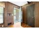 View of the foyer with wood paneling and access to front porch at 120 Westwood Nw Dr, Marietta, GA 30064