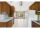 Eat in kitchen featuring vintage cabinets and view to dining room at 120 Westwood Nw Dr, Marietta, GA 30064