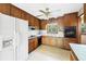 Kitchen featuring vintage cabinets, white appliances and linoleum flooring at 120 Westwood Nw Dr, Marietta, GA 30064