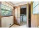 Bright laundry room with washer, dryer, and natural light from the window at 120 Westwood Nw Dr, Marietta, GA 30064