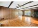 Spacious living room with hardwood floors and wood paneling at 120 Westwood Nw Dr, Marietta, GA 30064