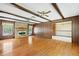 Spacious living room with hardwood floors, brick fireplace and backyard view at 120 Westwood Nw Dr, Marietta, GA 30064