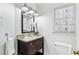 Charming bathroom vanity offers granite countertops and white porcelain sink with modern fixtures at 2125 Fairfax Dr, Alpharetta, GA 30009