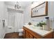 Bathroom features a vanity, mirror, shower-tub, and modern fixtures, offering a clean and functional space at 2125 Fairfax Dr, Alpharetta, GA 30009