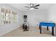 Bright room with ceiling fan, windows with blinds, and fitness equipment, offering a versatile space for recreation at 2125 Fairfax Dr, Alpharetta, GA 30009