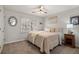 This cozy bedroom is enhanced with natural light and offers a nightstand and carpet flooring at 2125 Fairfax Dr, Alpharetta, GA 30009