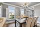 Bright dining room featuring a dining table and window with shutters at 2125 Fairfax Dr, Alpharetta, GA 30009