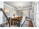 Elegant dining room with stylish chandelier and natural light at 2125 Fairfax Dr, Alpharetta, GA 30009