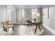 Home office with natural light, hardwood floors and neutral paint at 2125 Fairfax Dr, Alpharetta, GA 30009
