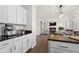Open kitchen area leading to living room and breakfast nook. Stainless appliances and granite countertops at 2125 Fairfax Dr, Alpharetta, GA 30009