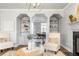 Elegant living room featuring built-in shelving and fireplace at 2125 Fairfax Dr, Alpharetta, GA 30009