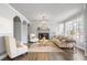 Bright living room with large windows, fireplace, and elegant furnishings at 2125 Fairfax Dr, Alpharetta, GA 30009