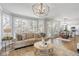 Open living area with expansive windows and seamless flow to kitchen and dining at 2125 Fairfax Dr, Alpharetta, GA 30009