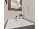 Elegant powder room featuring a modern sink and stylish decor at 2125 Fairfax Dr, Alpharetta, GA 30009