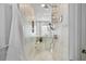 Bathroom view featuring an updated marble shower with bench and showerhead at 2125 Fairfax Dr, Alpharetta, GA 30009