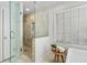 Bathroom view featuring a glass shower, free-standing tub, and natural light at 2125 Fairfax Dr, Alpharetta, GA 30009