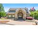 Charming clubhouse exterior featuring stone accents, manicured landscaping and inviting entrance at 347 Woodridge Pass, Canton, GA 30114