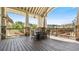 Outdoor deck with covered seating and scenic views perfect for outdoor relaxation and entertaining at 347 Woodridge Pass, Canton, GA 30114