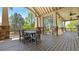 Outdoor deck with covered seating and scenic views perfect for outdoor relaxation and entertaining at 347 Woodridge Pass, Canton, GA 30114