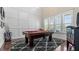Bright game room with high ceilings, grid accent wall, and a classic pool table at 347 Woodridge Pass, Canton, GA 30114