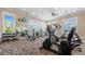 Bright gym featuring modern fitness equipment, large windows, and mirrored wall, promoting an active lifestyle at 347 Woodridge Pass, Canton, GA 30114