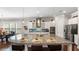 Spacious kitchen featuring a large island with granite countertops and stainless steel appliances at 347 Woodridge Pass, Canton, GA 30114