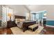 Spacious main bedroom with a fireplace and seating area, complemented by hardwood floors at 347 Woodridge Pass, Canton, GA 30114