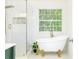Elegant bathroom with clawfoot tub, gold fixtures, and glass shower at 3554 Cherry Bloom Way, Decatur, GA 30034