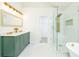 Spacious bathroom with double vanity, marble counters, and walk-in shower at 3554 Cherry Bloom Way, Decatur, GA 30034
