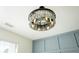 Close-up of a modern, bejeweled chandelier in the dining room at 3554 Cherry Bloom Way, Decatur, GA 30034