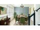 Sophisticated dining room featuring stylish decor, modern lighting, and seating for eight at 3554 Cherry Bloom Way, Decatur, GA 30034