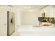 Bright kitchen featuring white cabinets, stainless steel appliances, and a large kitchen island at 3554 Cherry Bloom Way, Decatur, GA 30034