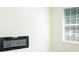 Modern electric fireplace with large window at 3554 Cherry Bloom Way, Decatur, GA 30034